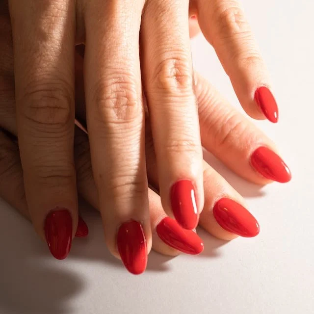 Rounded nails painted red