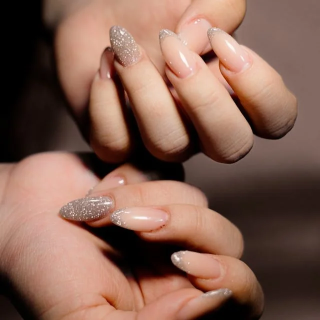 Long painted nails with silver glitter